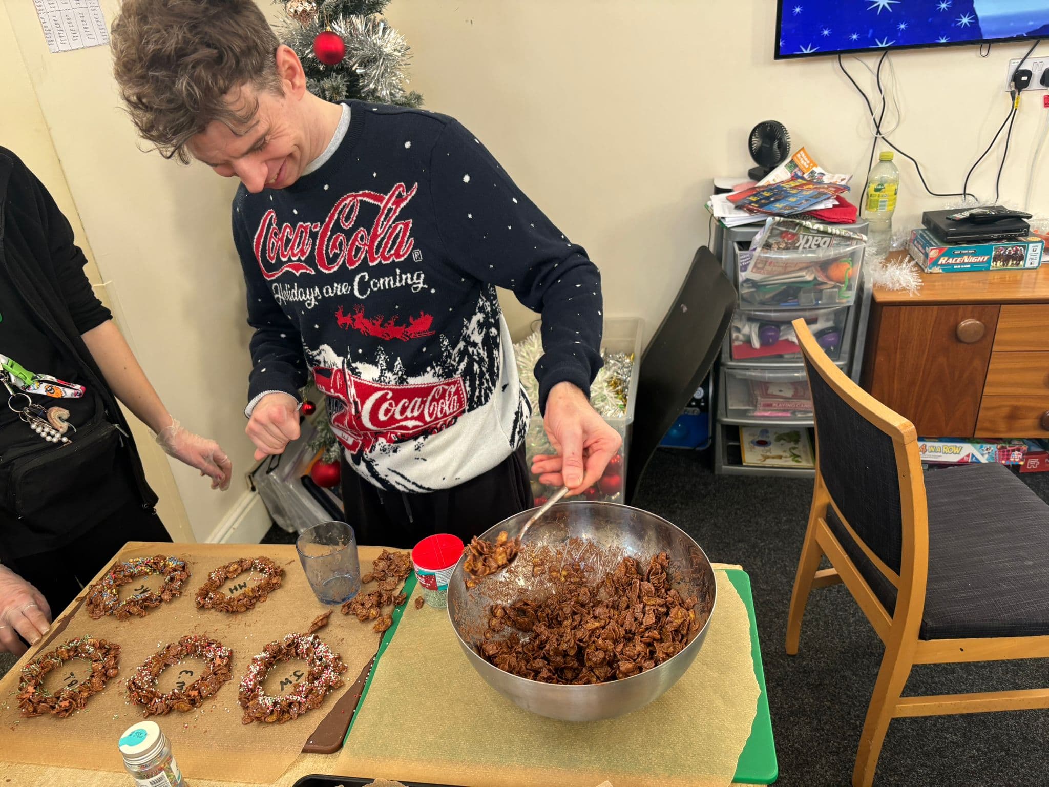 A young adult taking part in a baking session at Edmund Street Activity Centre