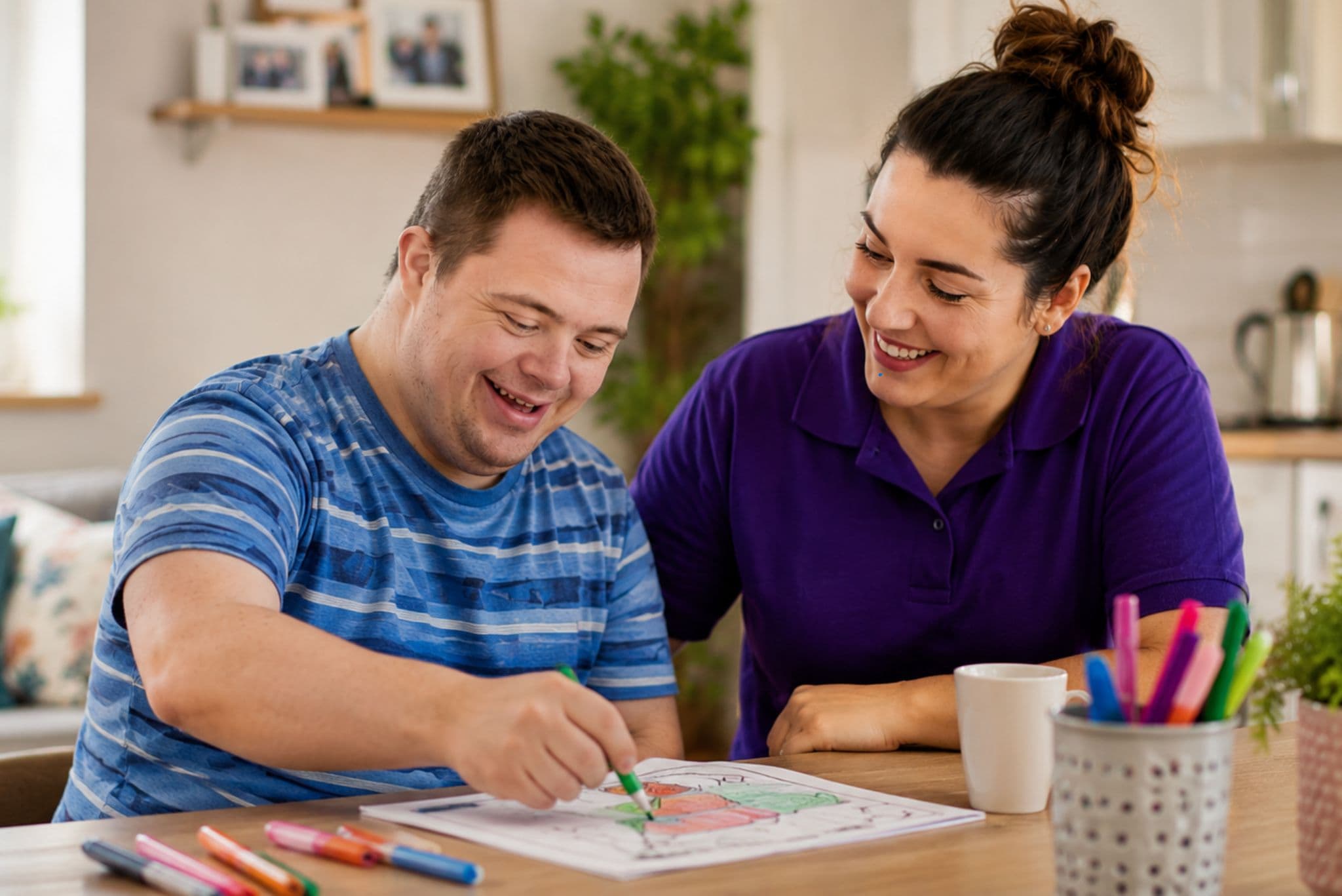 A HomeCare Chesterfield carer supporting an individual with an activity at home